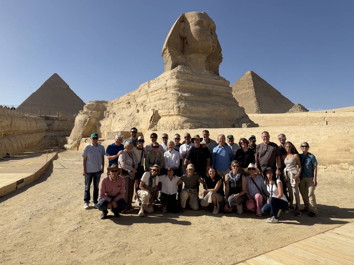 Cultured Travel's 12-day Egypt tour group at the Great Sphinx with the Pyramids of Giza