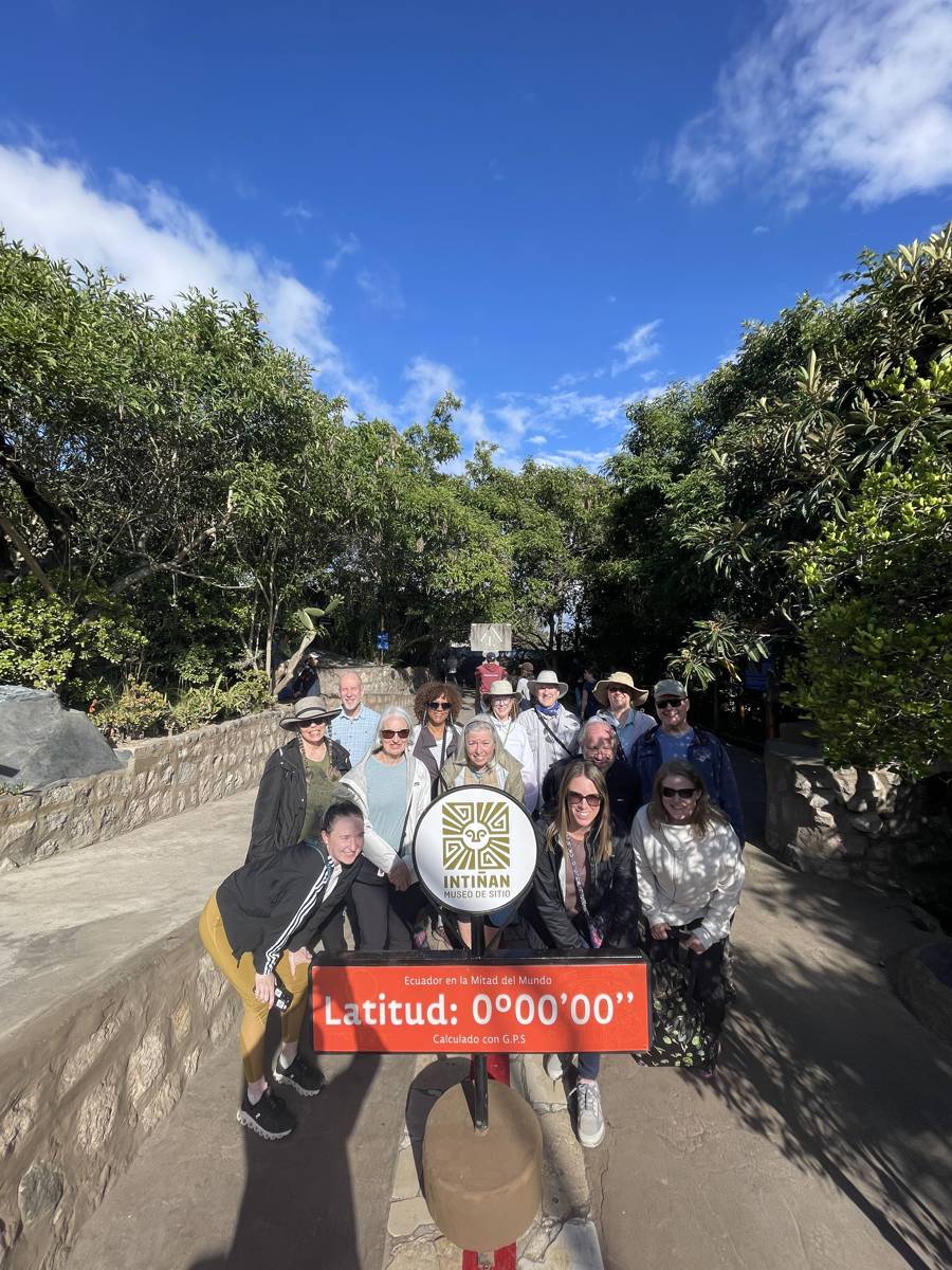Cultured Travel group at the equator line at Latitude 0 degrees in Quito, Ecuador